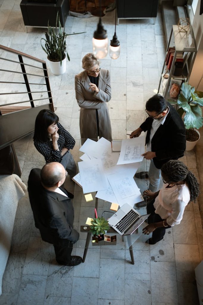 pexels photo 5922204 A team of professionals engage in a business meeting in a sleek, modern office setting.